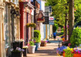 Hudson, OH, USA - June 14, 2014: Quaint shops and businesses dating back more than a century line Hudson's Main Street looking north.